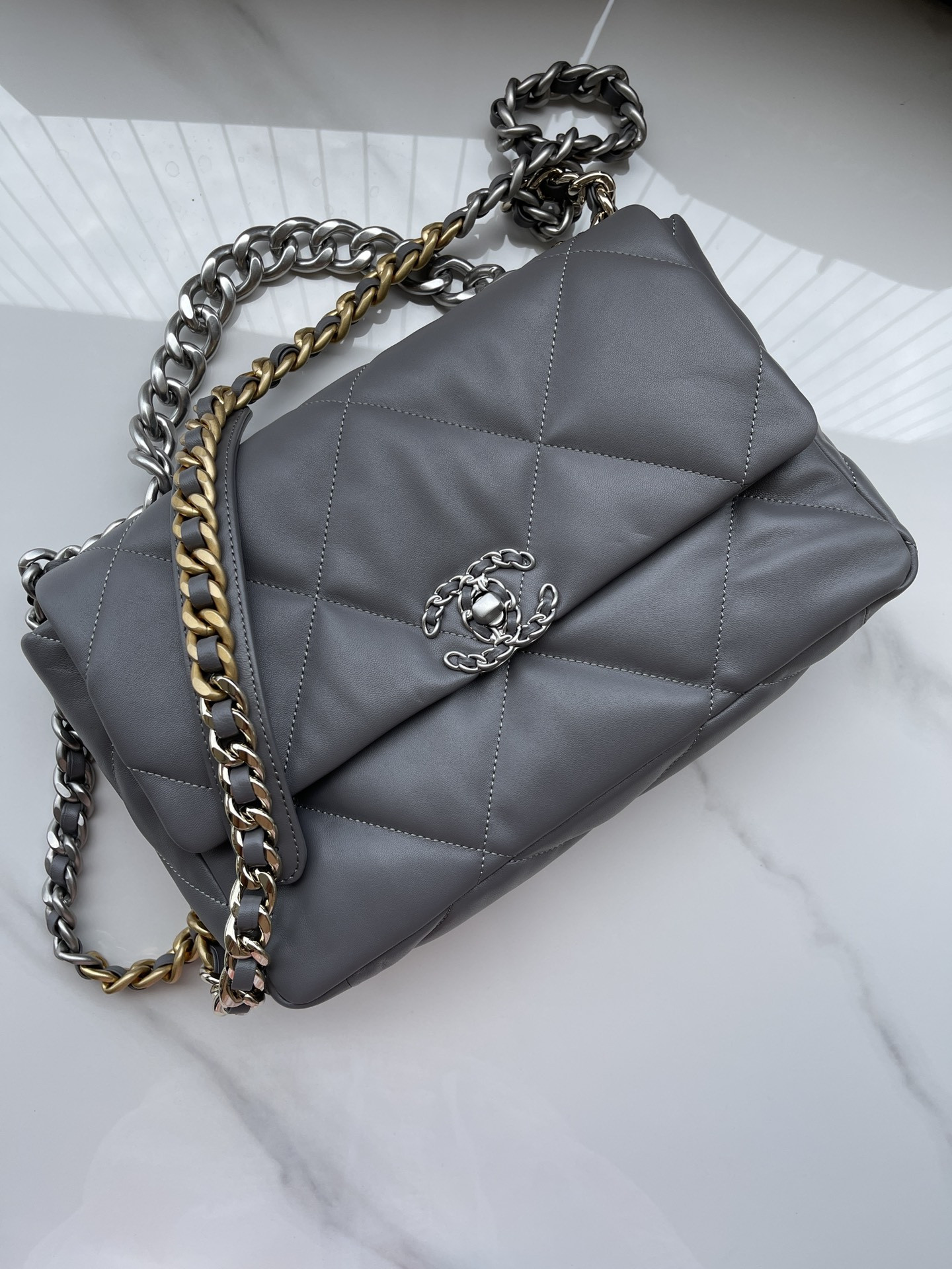 Ch**el 19 LARGE HANDBAG Shiny Leather, Gold-Tone, Silver-Tone & Ruthenium-Finish Metal Gray 7.8 × 11.7 × 3.9 in