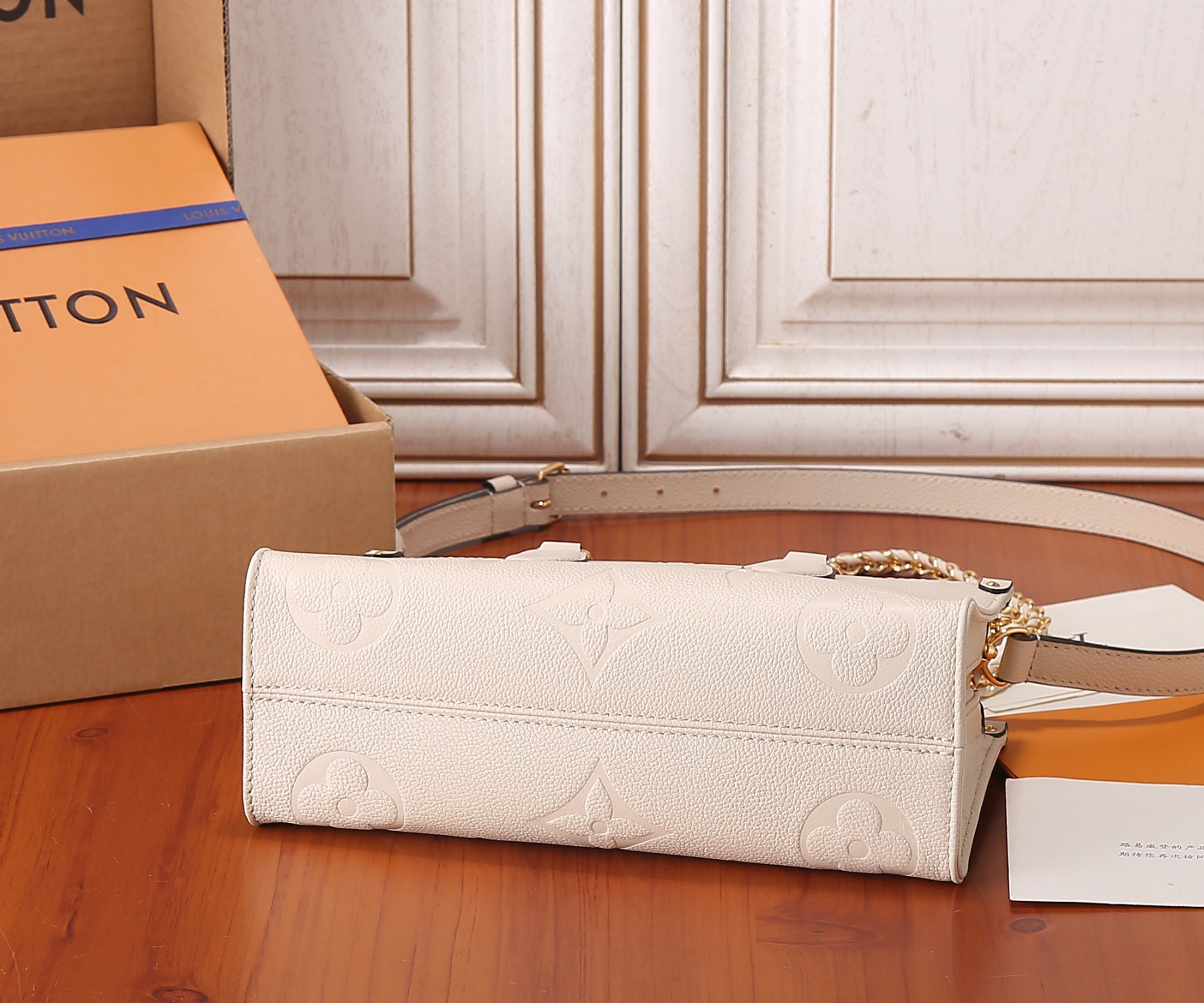 LV OnTheGo East West M23698 9.8 x 5.1 x 3.9 inches